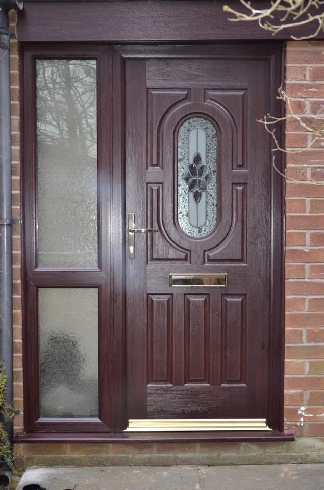 uPVC door in rosewood with frosted glass side panels