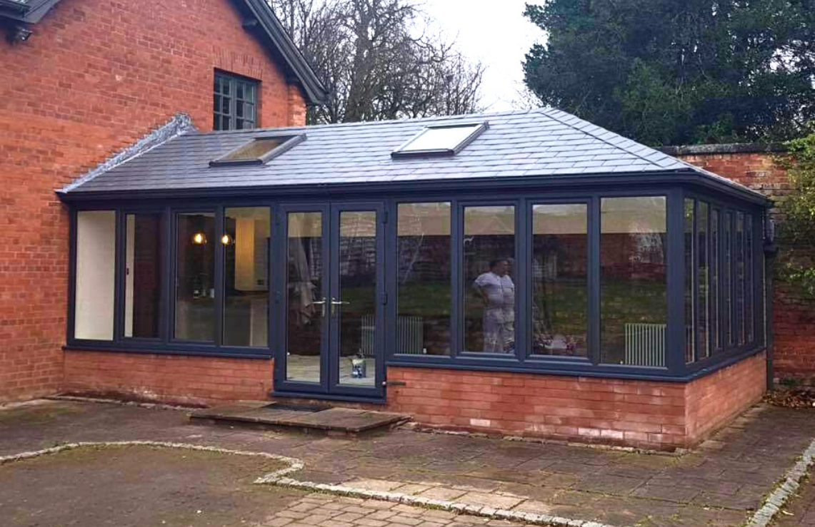 A Conservatory With an insulated tiled roof