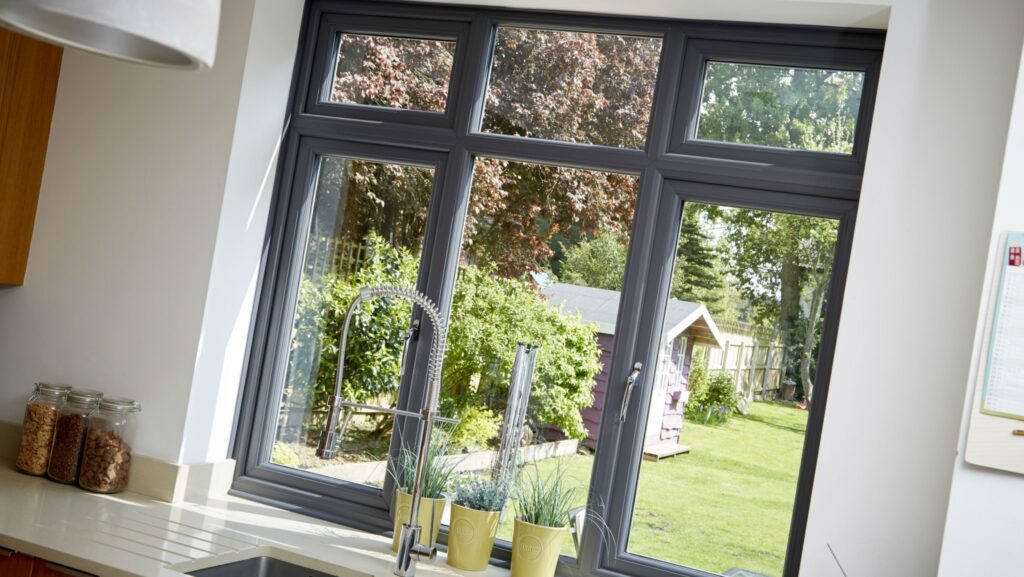 a photograph of the interior of a kitchen with anthracite grey windows