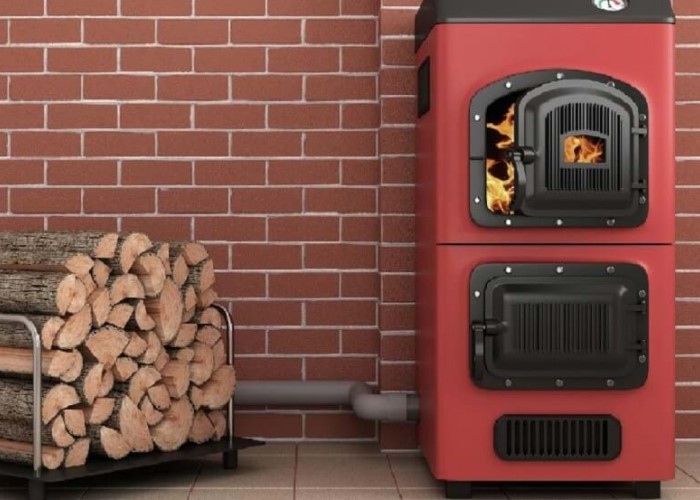 a photograph of logs and a log burning stove in red