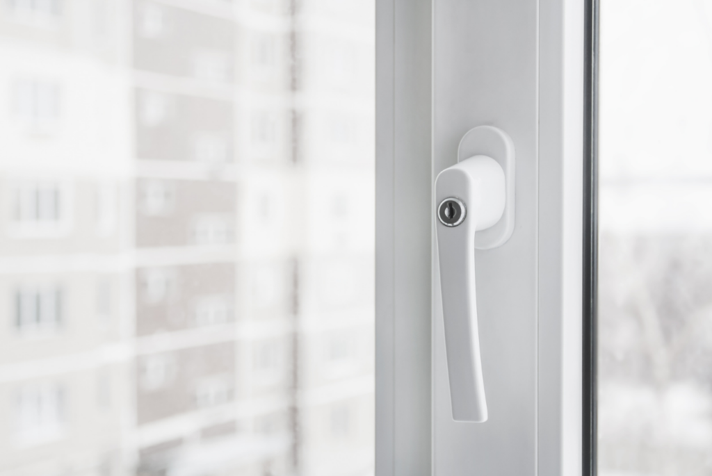 a white upvc window handle