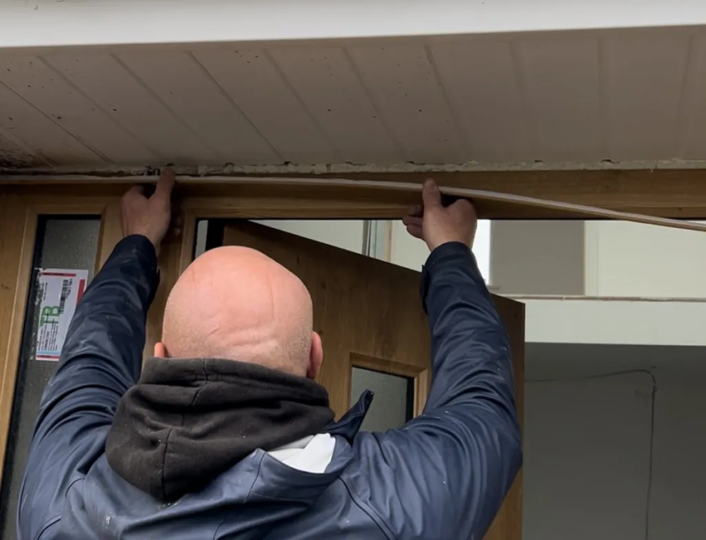 Engineer fitting trims on Manhattan Rockdoor